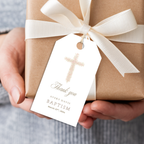 Soft pink floral baptism favor tag with elegant blush floral cross attached to kraft gift packaging