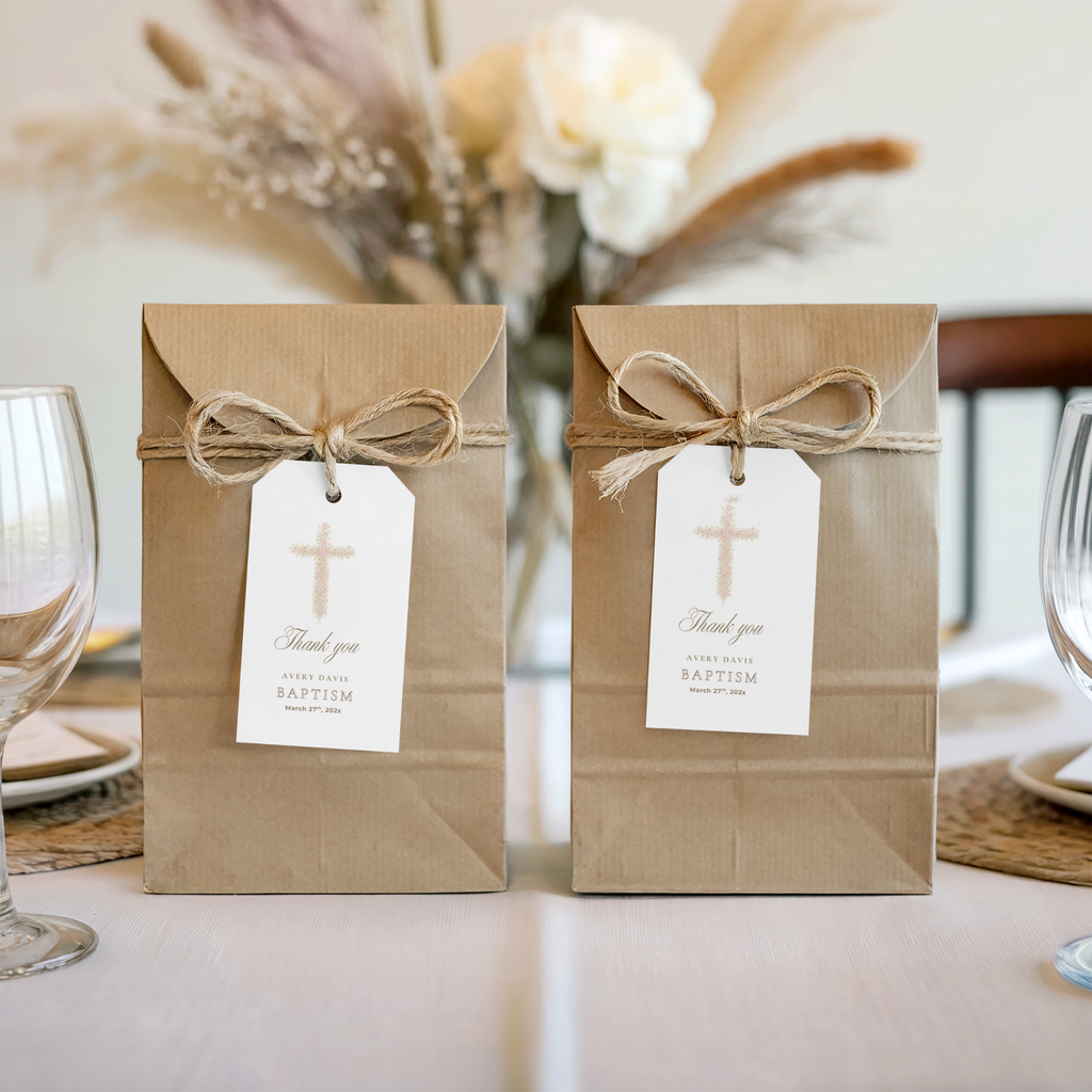 Soft pink floral baptism favor tag with elegant blush floral cross attached to kraft gift packaging