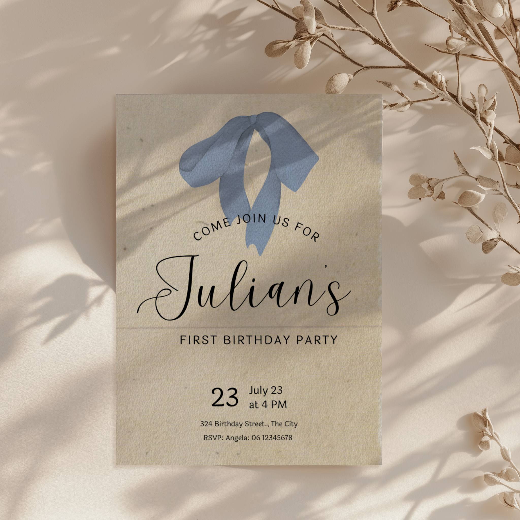 Minimalist first birthday invitation with blue bow illustration and soft neutral background