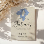 Minimalist first birthday invitation with blue bow illustration and soft neutral background