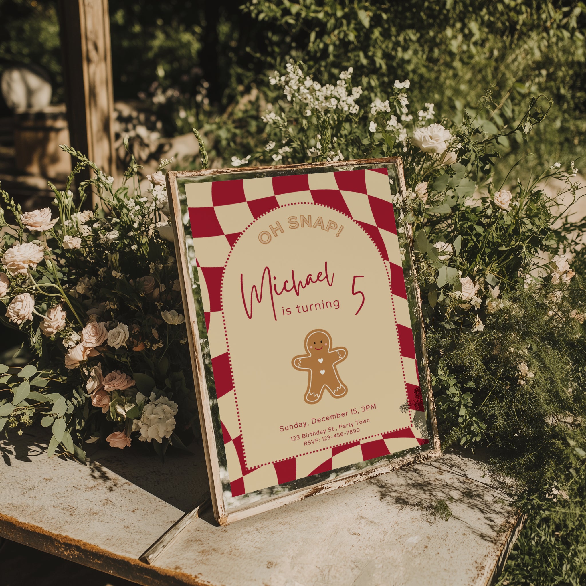 Gingerbread Christmas birthday invitation with cookie illustration and red checkered background