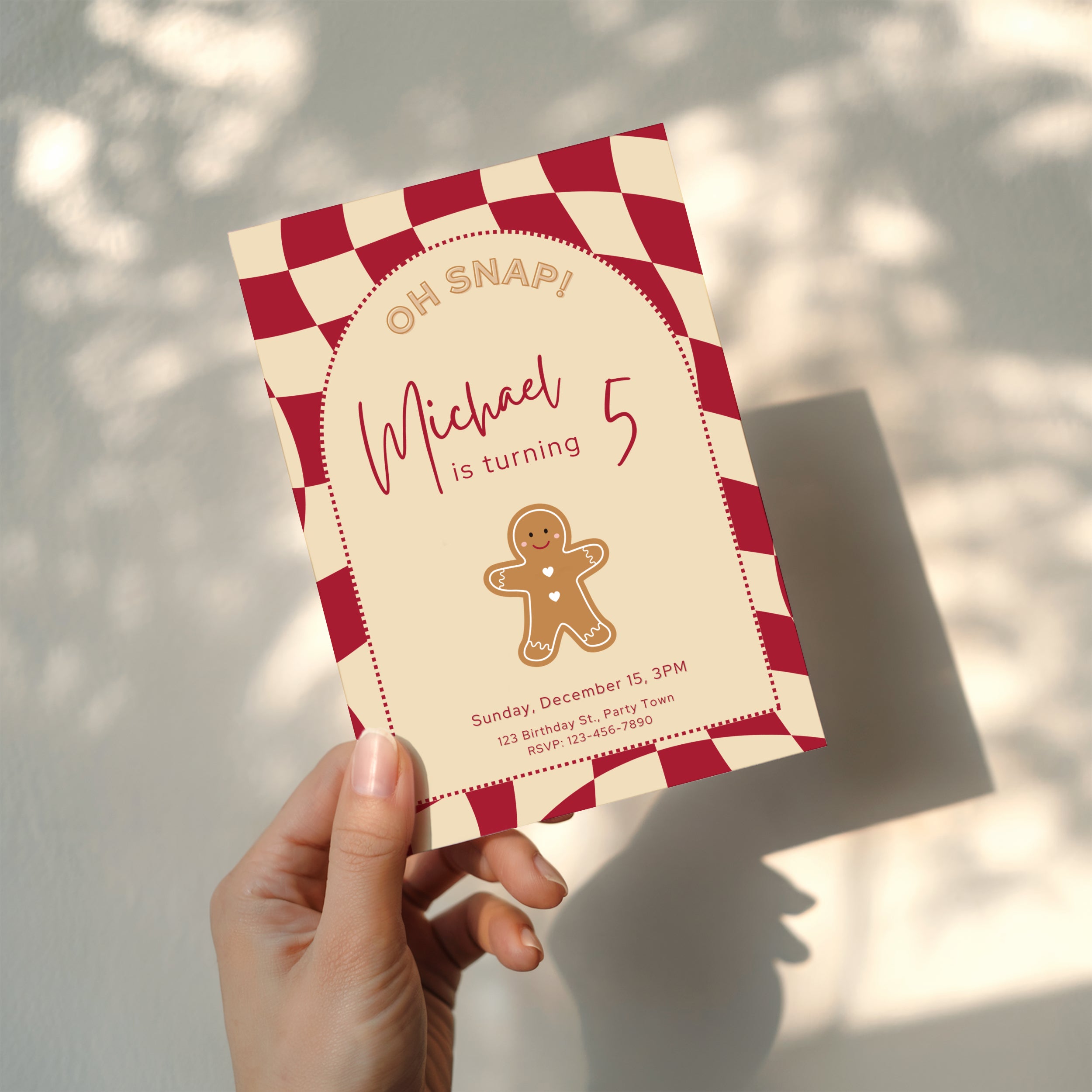 Gingerbread Christmas birthday invitation with cookie illustration and red checkered background