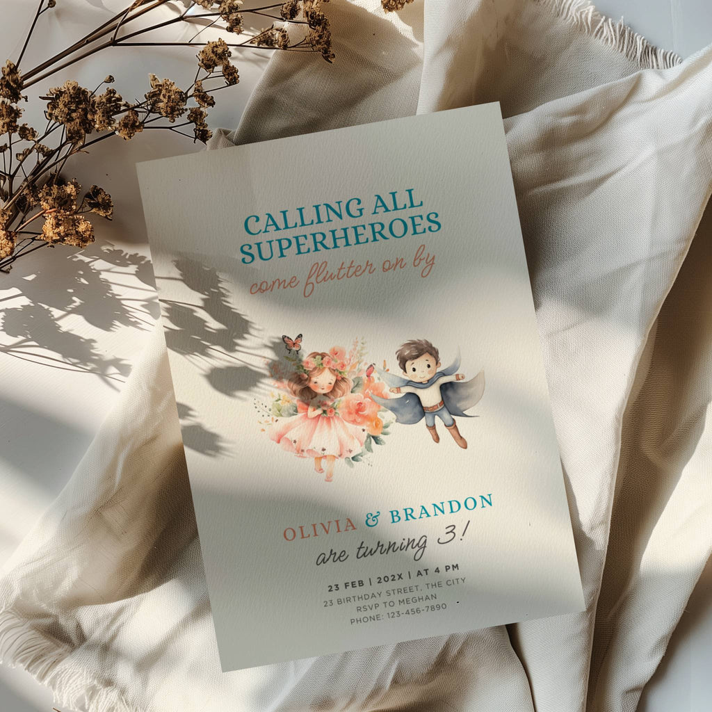 Boy girl twin birthday invitation with superhero boy and fairy girl illustration and floral accents