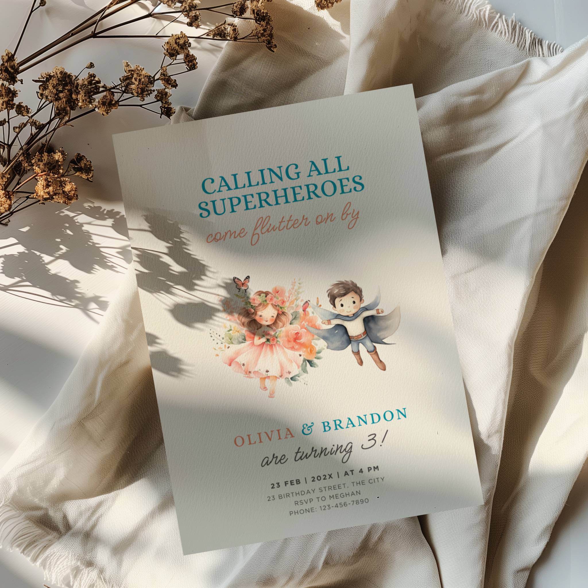 Boy girl twin birthday invitation with superhero boy and fairy girl illustration and floral accents