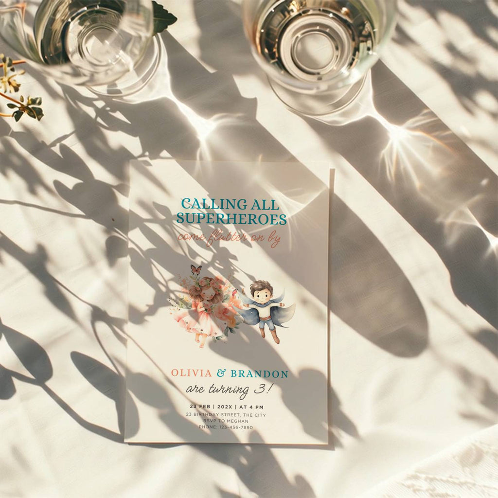 Boy girl twin birthday invitation with superhero boy and fairy girl illustration and floral accents
