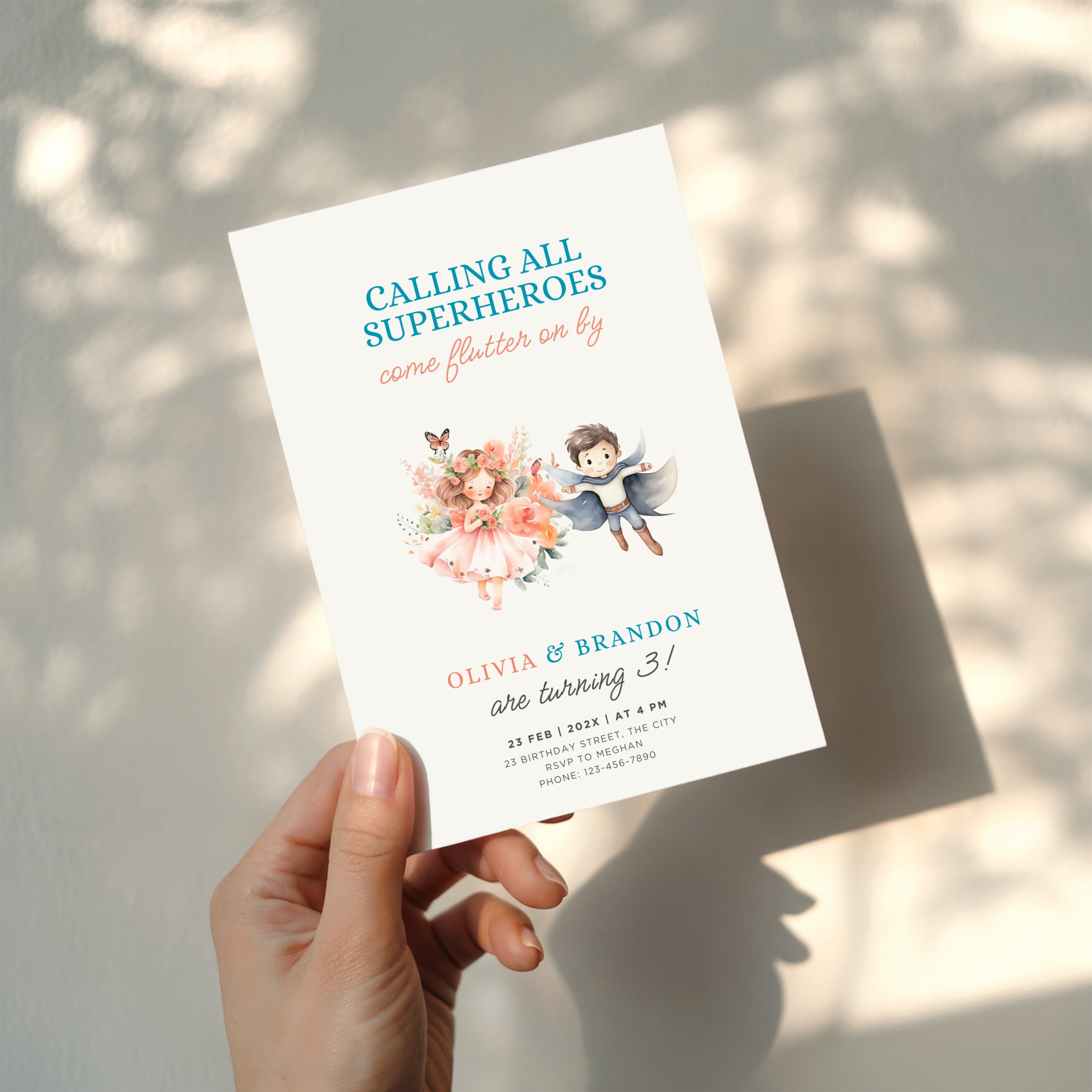 Boy girl twin birthday invitation with superhero boy and fairy girl illustration and floral accents