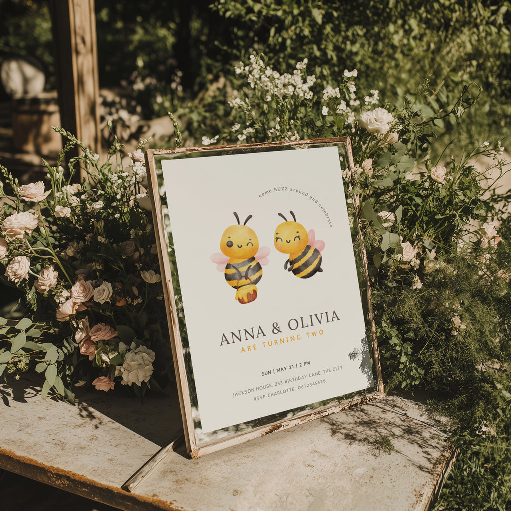Twin birthday invitation with cute bee illustration and buzz around theme in soft yellow tones