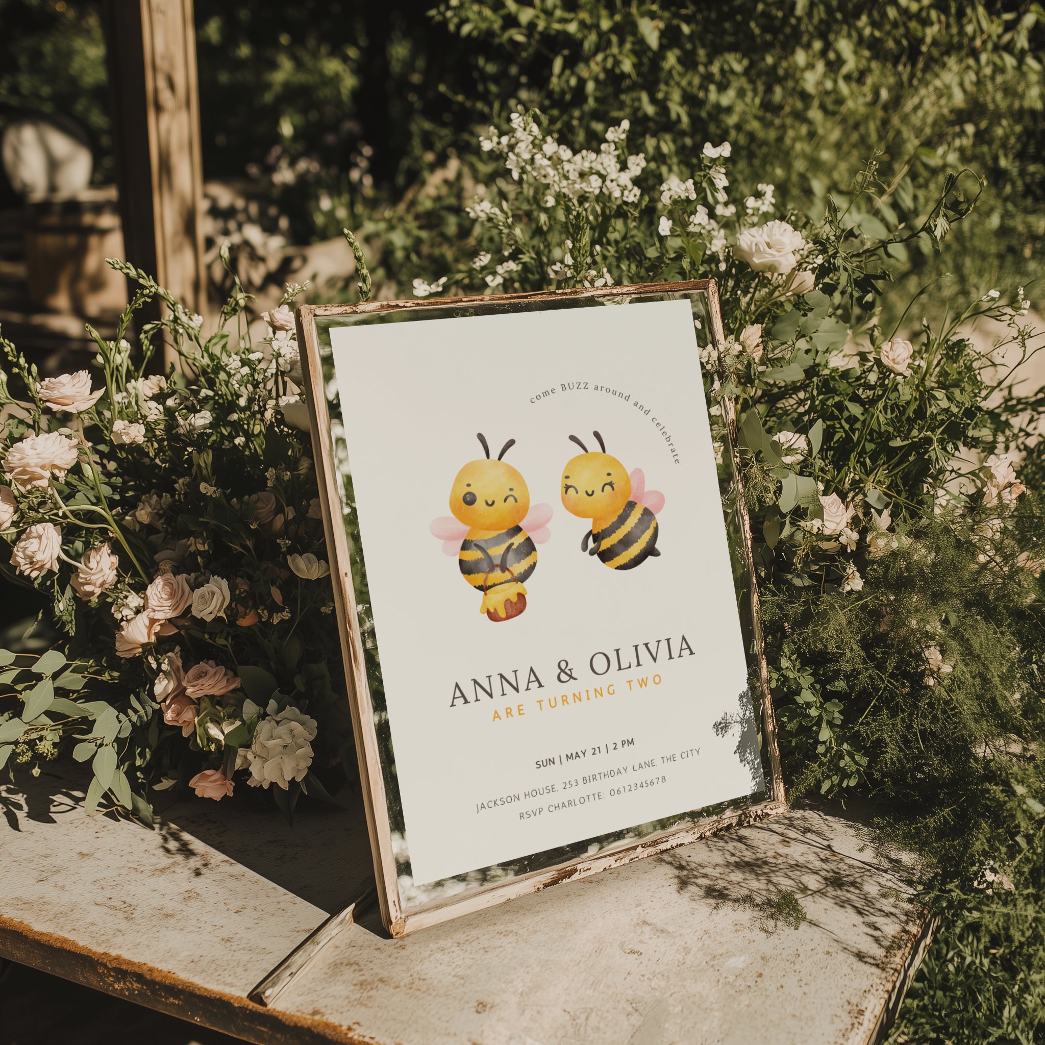 Twin birthday invitation with cute bee illustration and buzz around theme in soft yellow tones