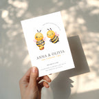 Twin birthday invitation with cute bee illustration and buzz around theme in soft yellow tones