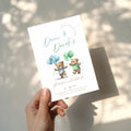 Beary first birthday boy twins invitation with teddy bear illustration and blue and green balloons