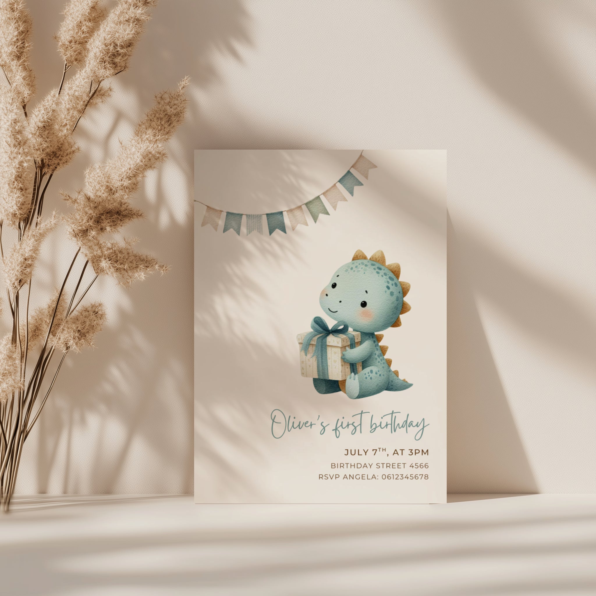 Dinosaur first birthday invitation with cute baby dinosaur holding a gift in soft pastel colors