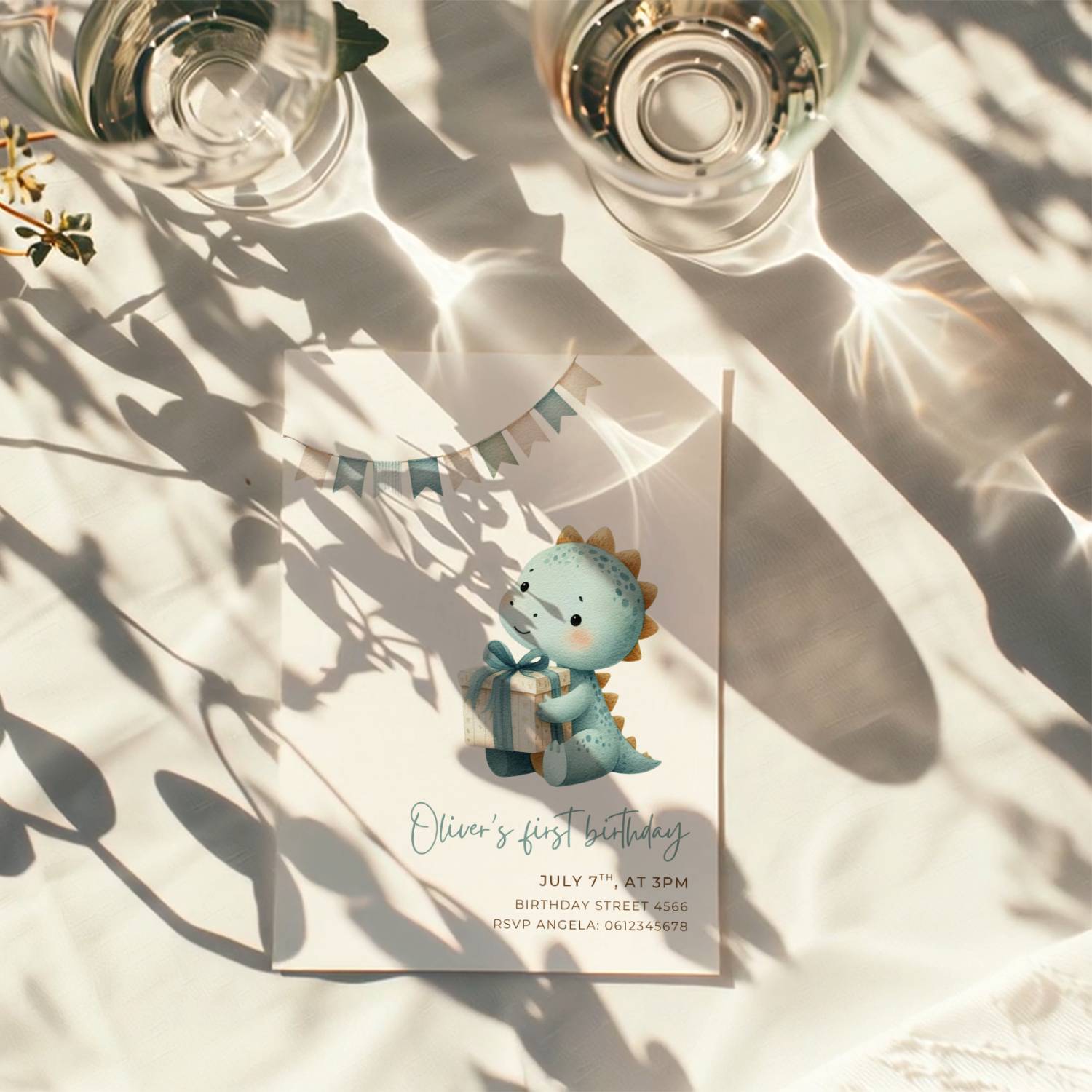 Dinosaur first birthday invitation with cute baby dinosaur holding a gift in soft pastel colors