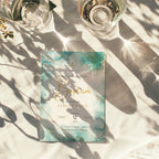 Teal marble baptism invitation with gold cross and elegant gold accents for a modern religious celebration