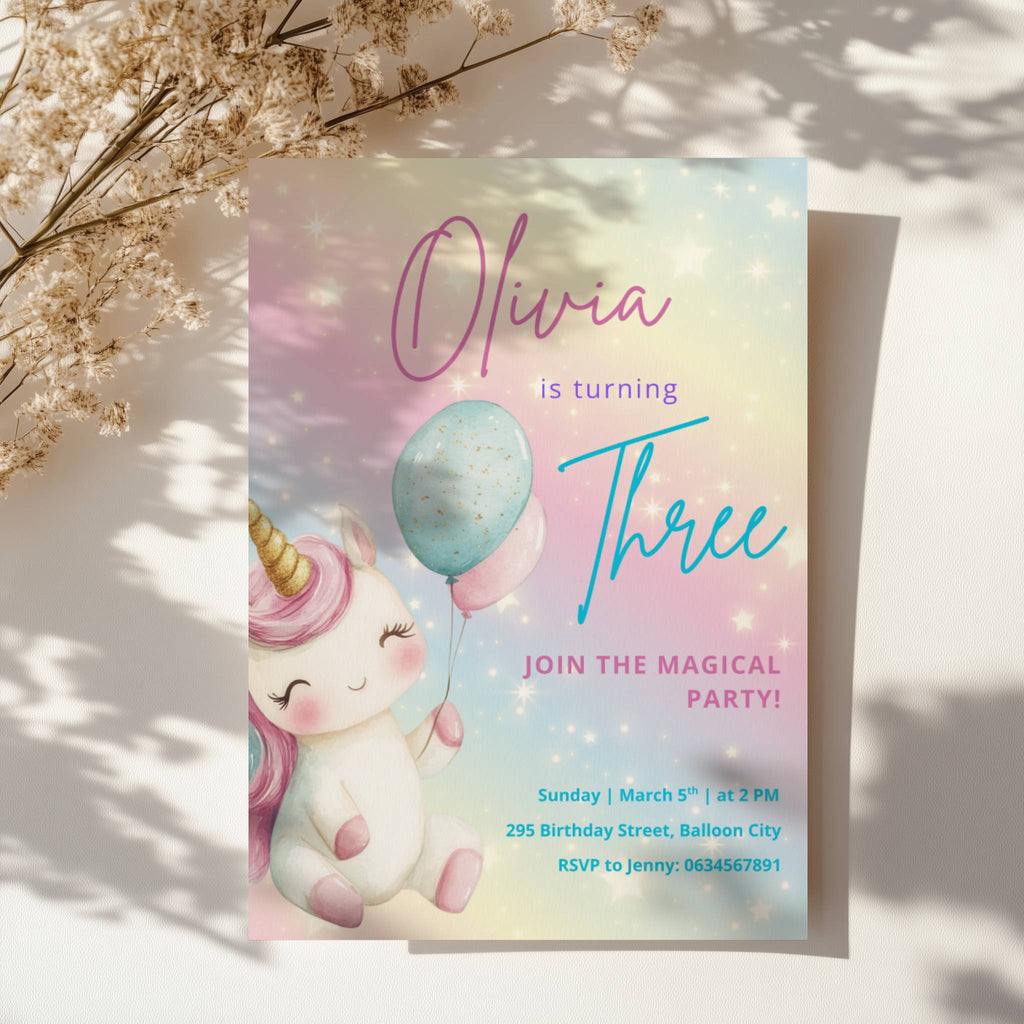 Pastel rainbow unicorn birthday invitation with balloons and magical theme for a girls birthday party