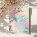Pastel rainbow unicorn birthday invitation with balloons and magical theme for a girls birthday party