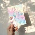 Pastel rainbow unicorn birthday invitation with balloons and magical theme for a girls birthday party