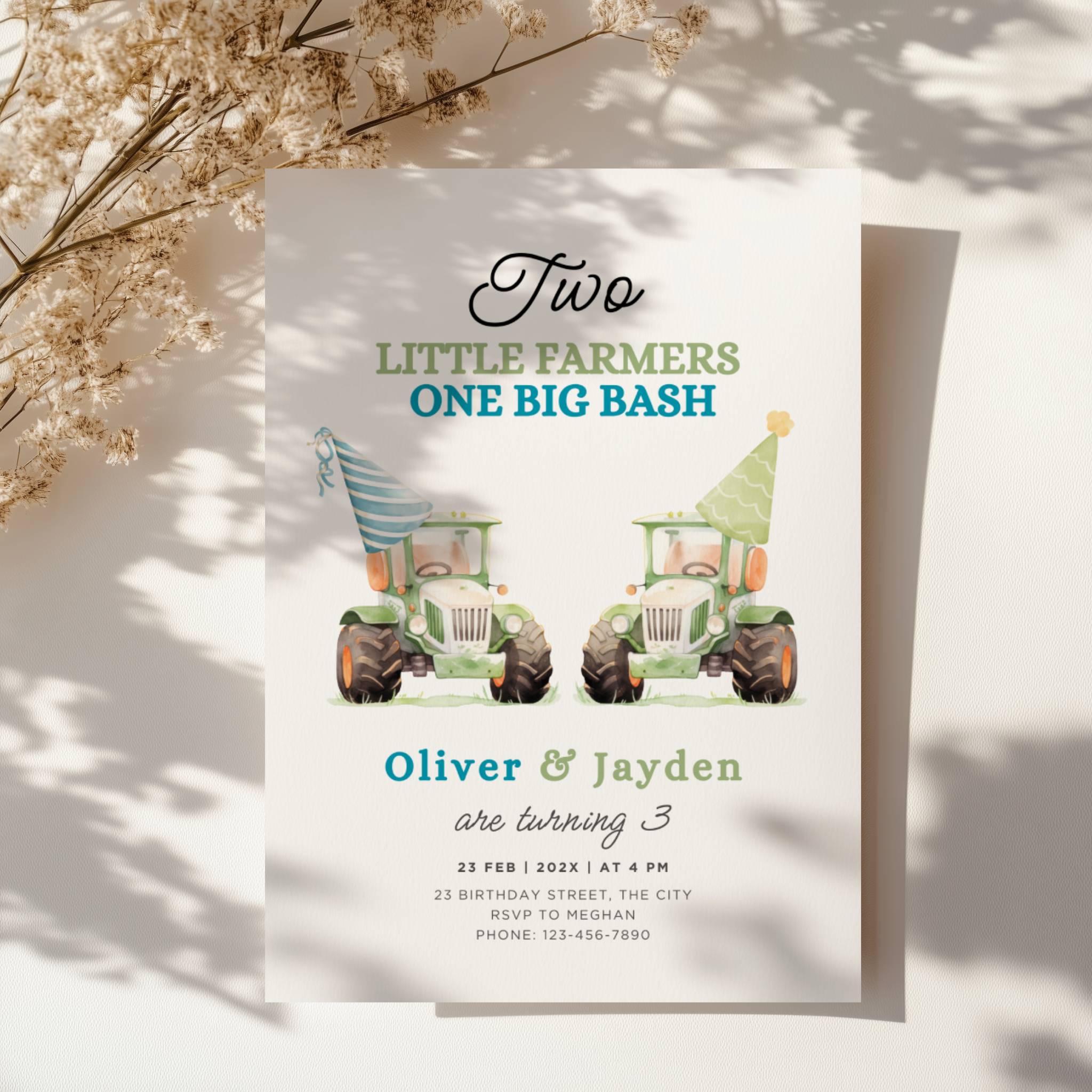 Twin birthday invitation with two green tractors wearing party hats in a cute farm theme design