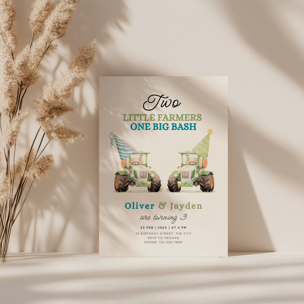 Twin birthday invitation with two green tractors wearing party hats in a cute farm theme design