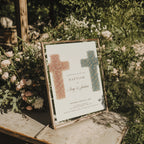 Twin baptism invitation with two floral crosses in terracotta and blue tones for siblings celebration