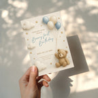 Beary first birthday invitation with teddy bear holding balloons in soft neutral colors with clouds and stars for a baby first birthday party