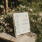 Minimal blue floral baptism invitation with delicate botanical elements and cross design for a baby boy christening