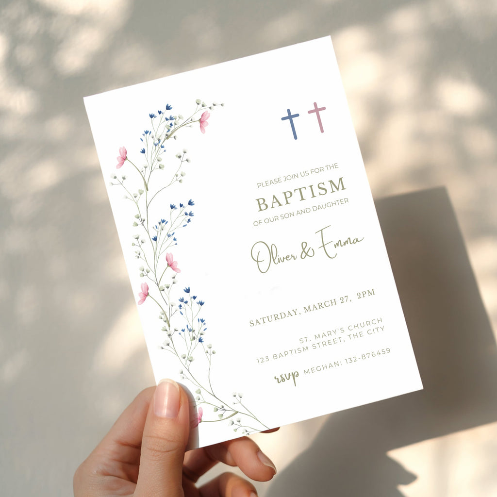 Floral baptism invitation for twins with blue and pink cross and delicate botanical elements for a sibling christening celebration