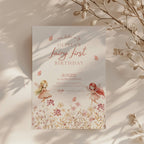 Fairy first birthday invitation with soft floral wildflower design and pastel colors