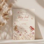 Fairy first birthday invitation with soft floral wildflower design and pastel colors