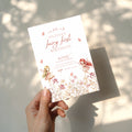 Fairy first birthday invitation with soft floral wildflower design and pastel colors