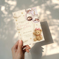 Teddy bear first birthday invitation with photo collage and pastel design