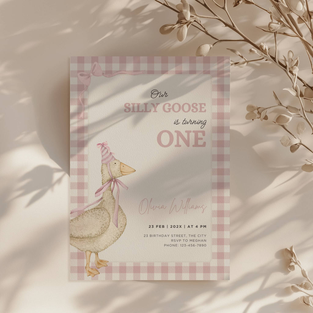 one silly goose first birthday invitation with pink gingham background and bow details