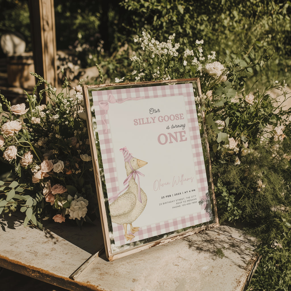 one silly goose first birthday invitation with pink gingham background and bow details