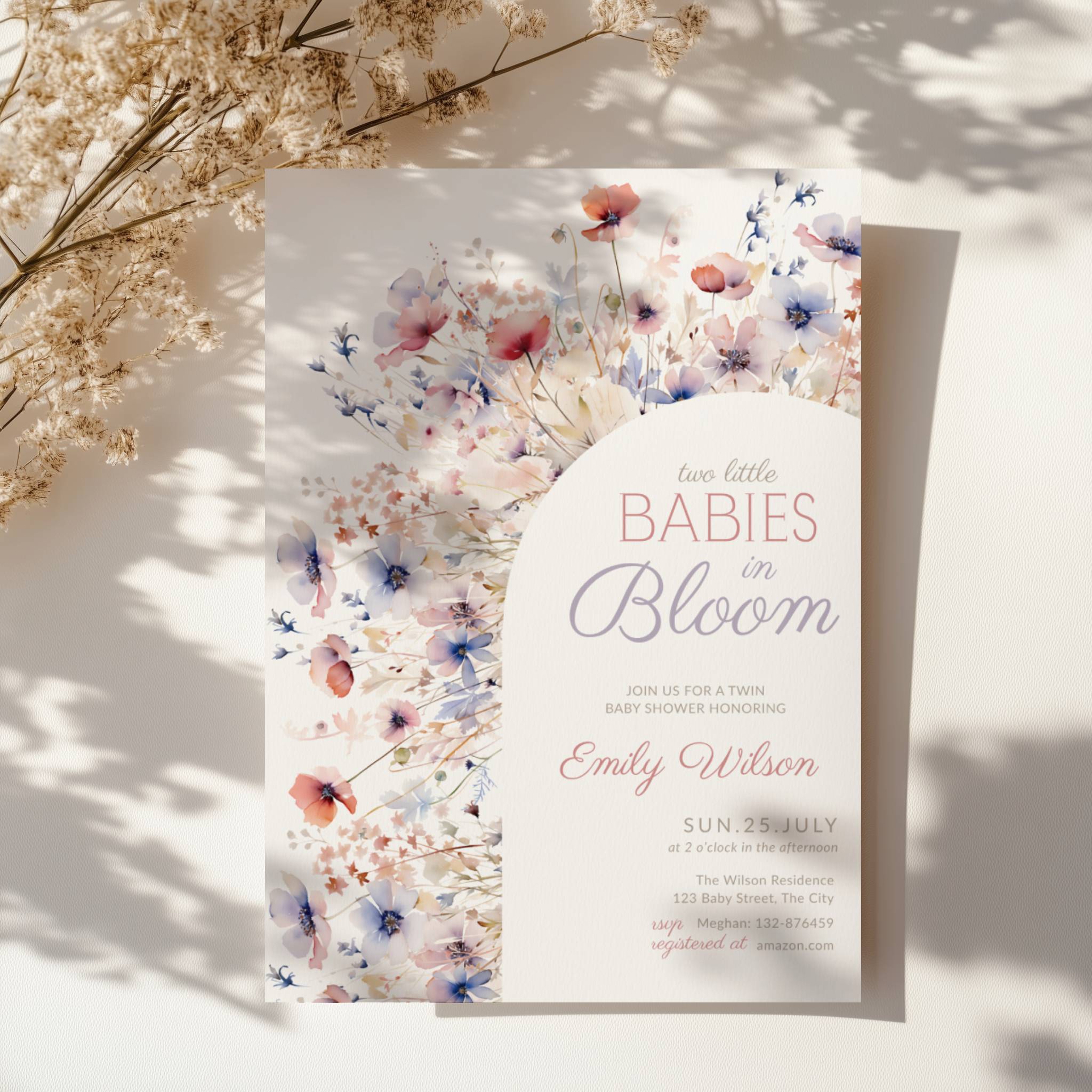two babies in bloom twin baby shower invitation with pastel floral arch in blush and blue tones
