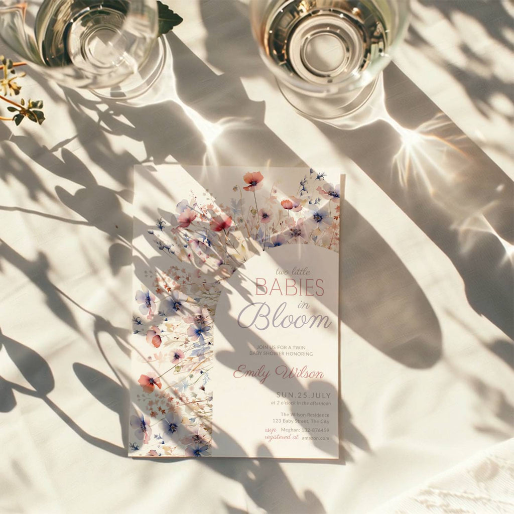 two babies in bloom twin baby shower invitation with pastel floral arch in blush and blue tones