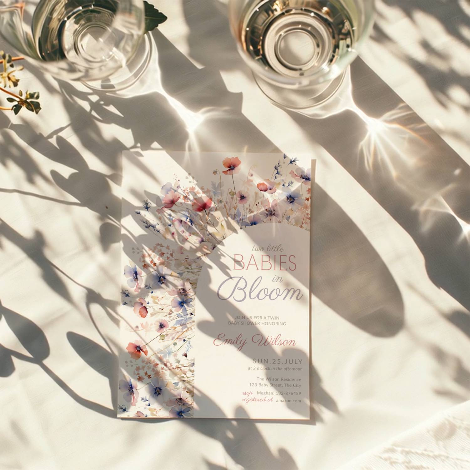 two babies in bloom twin baby shower invitation with pastel floral arch in blush and blue tones