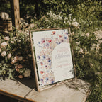 two babies in bloom twin baby shower invitation with pastel floral arch in blush and blue tones