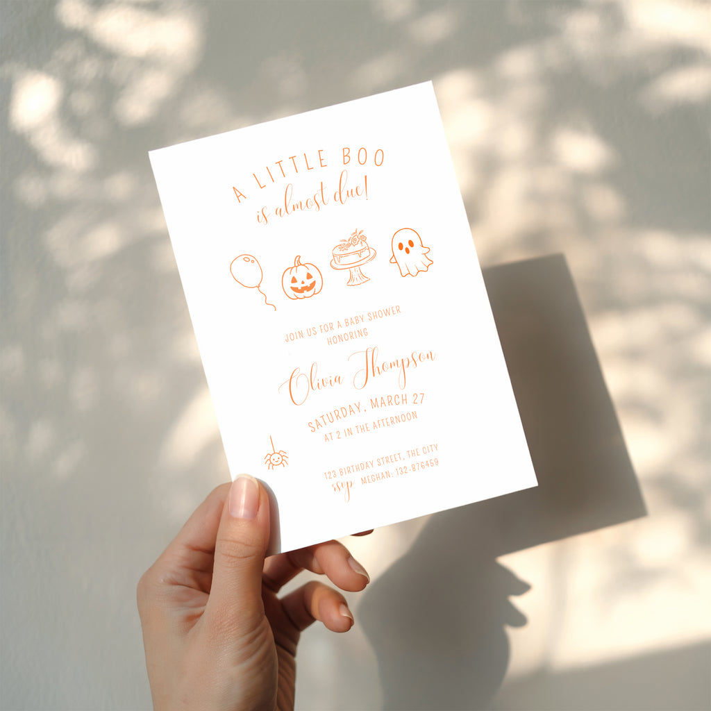 minimalist halloween baby shower invitation with orange line art pumpkin ghost and “little boo is almost due” text