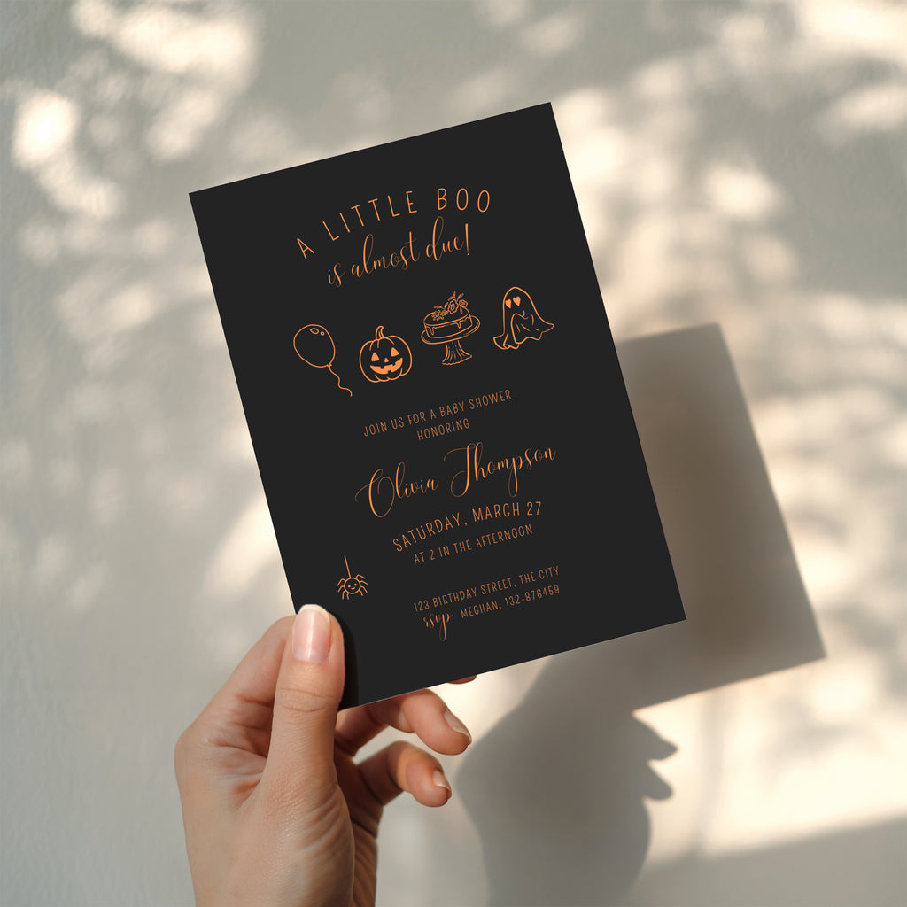 dark halloween baby shower invitation with orange line art pumpkin ghost and “little boo is almost due” text
