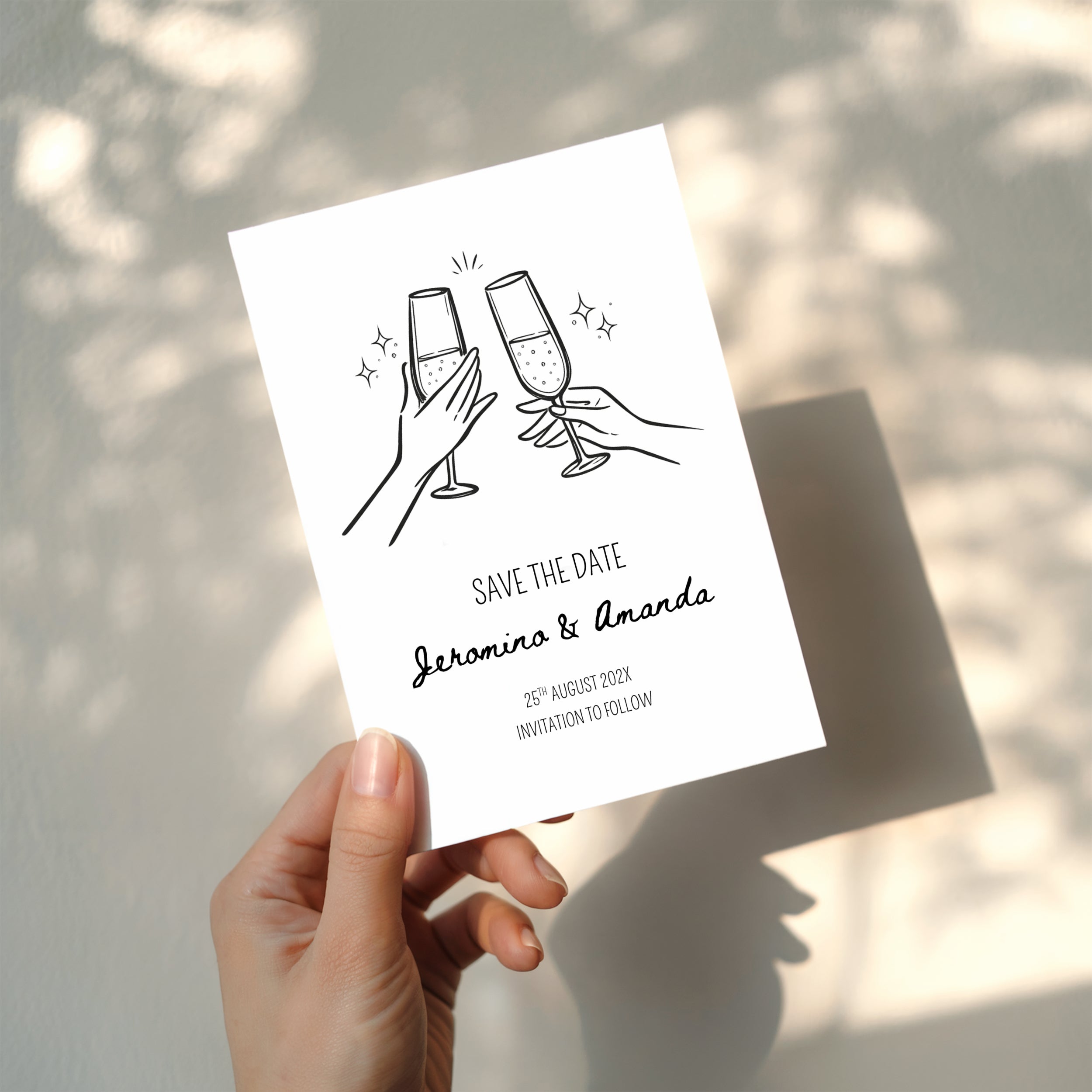 minimalist save the date invitation with champagne glasses toast line drawing and script names