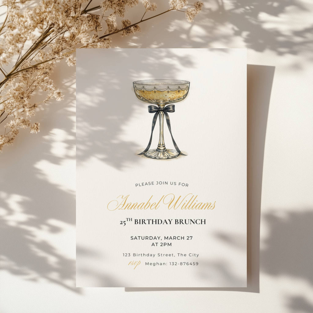 elegant 25th birthday brunch invitation with champagne glass and black bow illustration and gold script text
