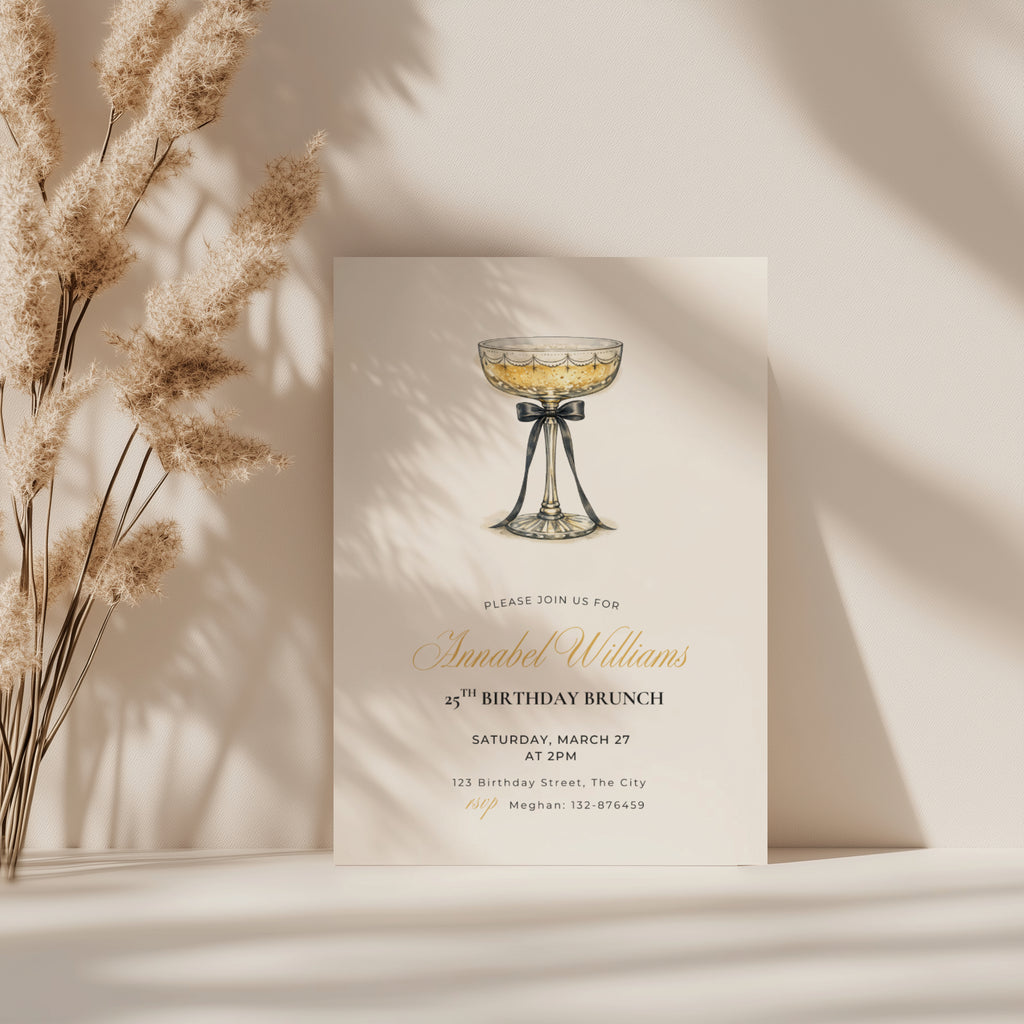 elegant 25th birthday brunch invitation with champagne glass and black bow illustration and gold script text