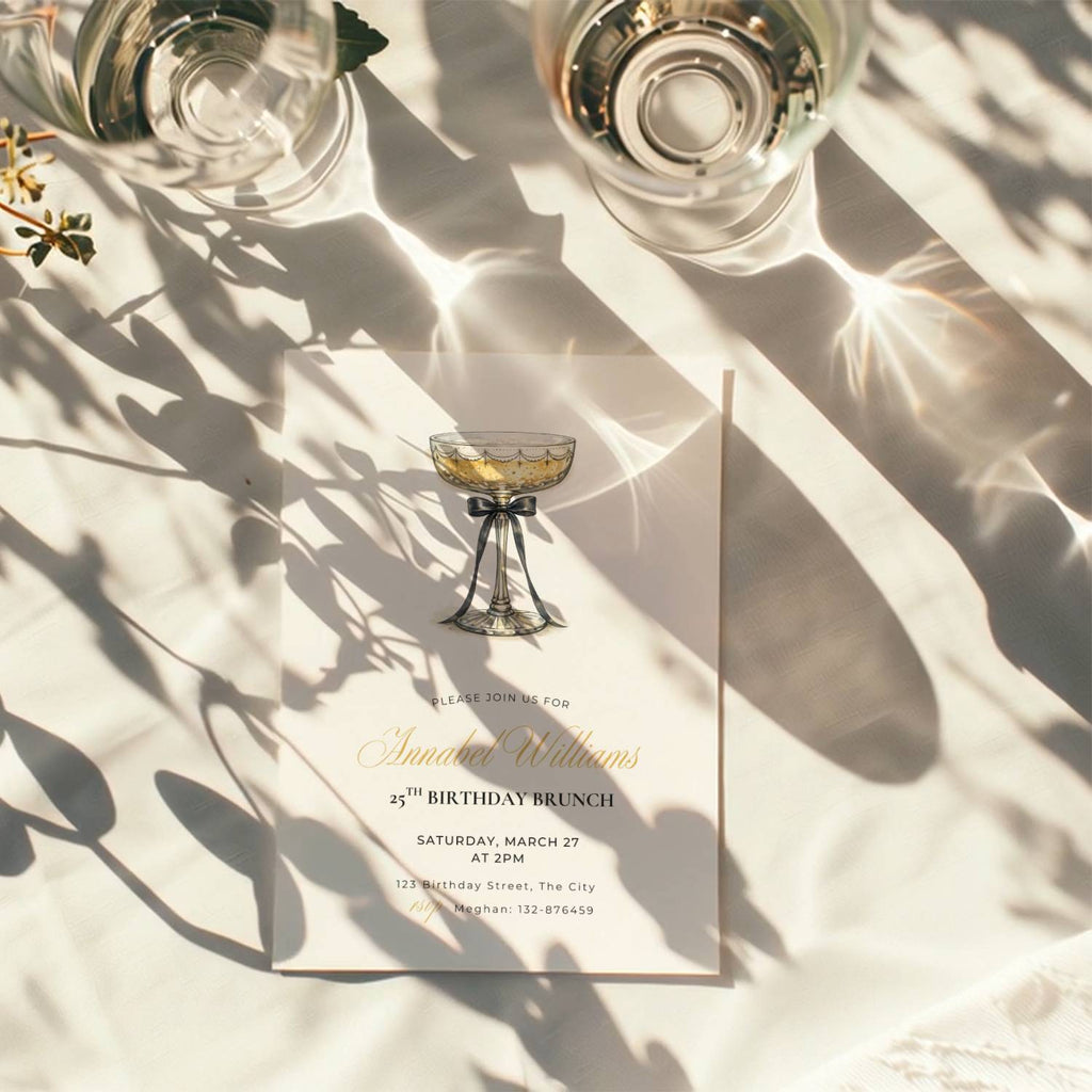 elegant 25th birthday brunch invitation with champagne glass and black bow illustration and gold script text