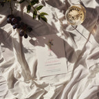 elegant 21st birthday invitation with champagne flute, flowers, and pink bow design