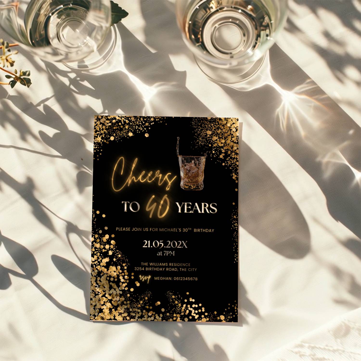 black and gold 40th birthday invitation with confetti, glowing text, and whiskey glass illustration