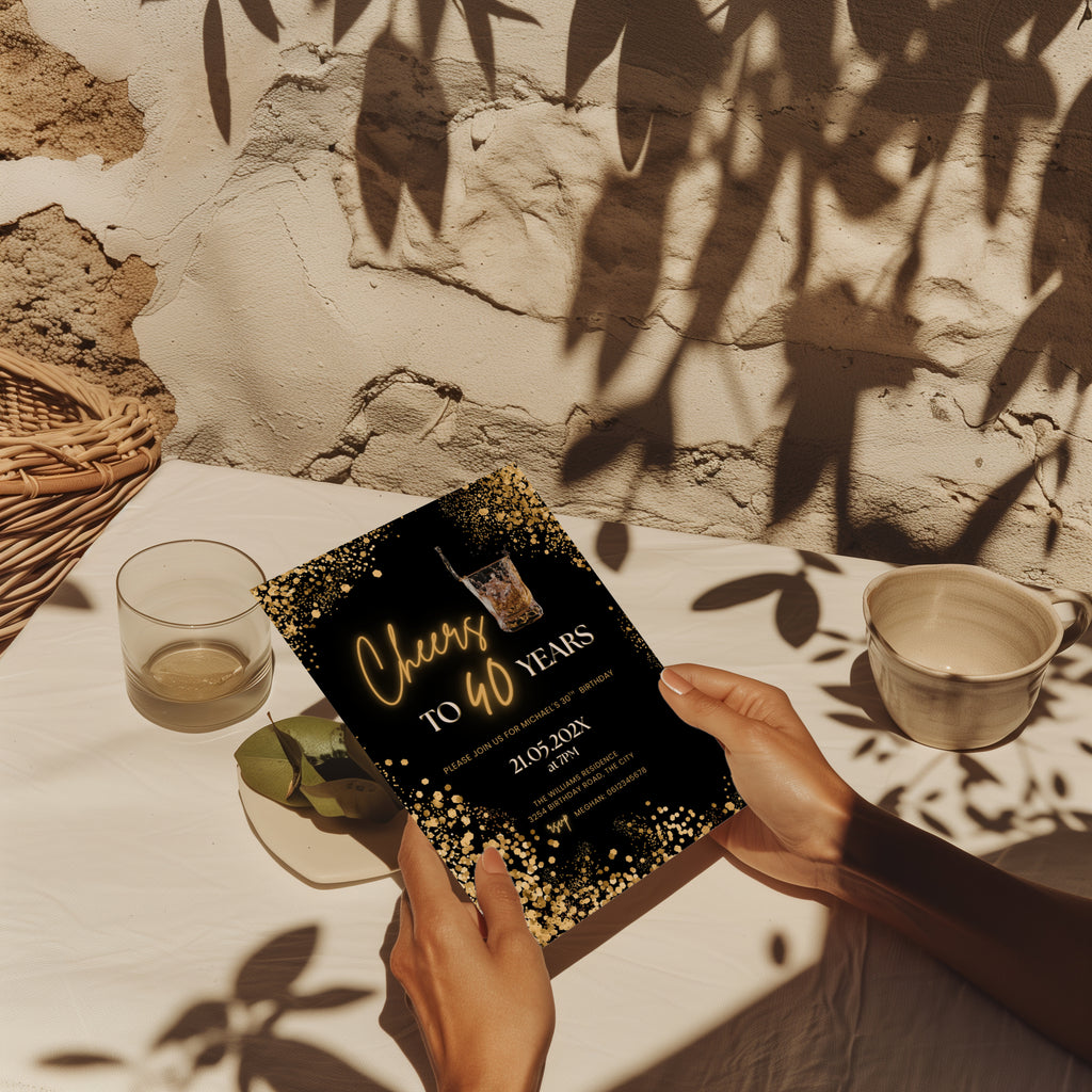 black and gold 40th birthday invitation with confetti, glowing text, and whiskey glass illustration