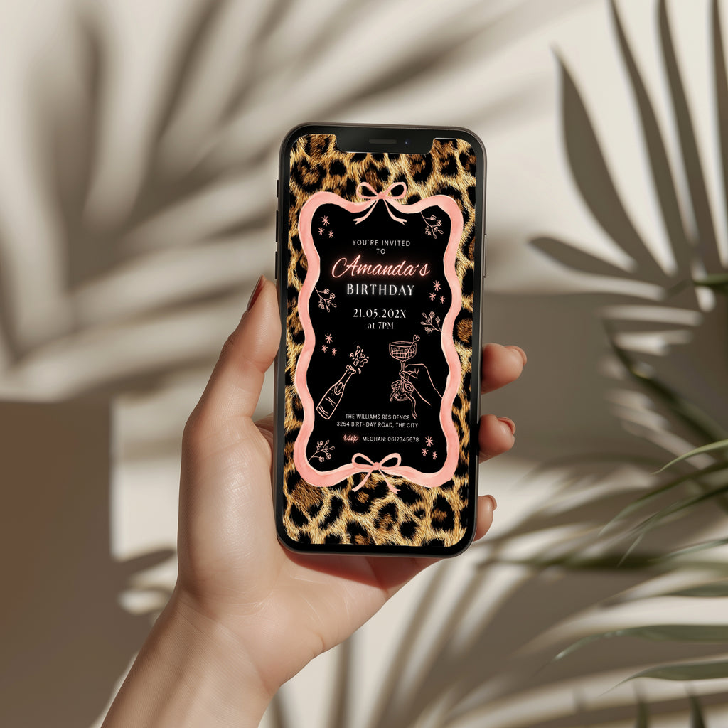 cheetah print birthday invitation with pink ribbon border and black center design