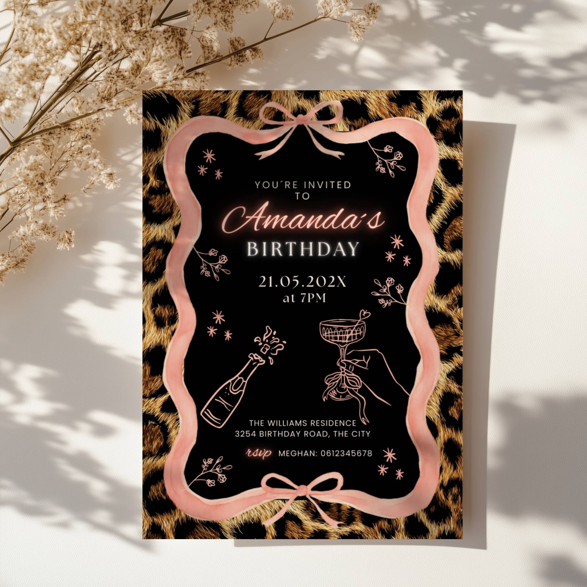 cheetah print birthday invitation with pink ribbon border and black center design