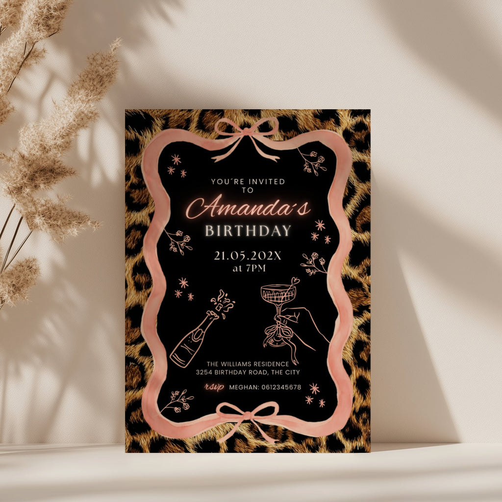 cheetah print birthday invitation with pink ribbon border and black center design