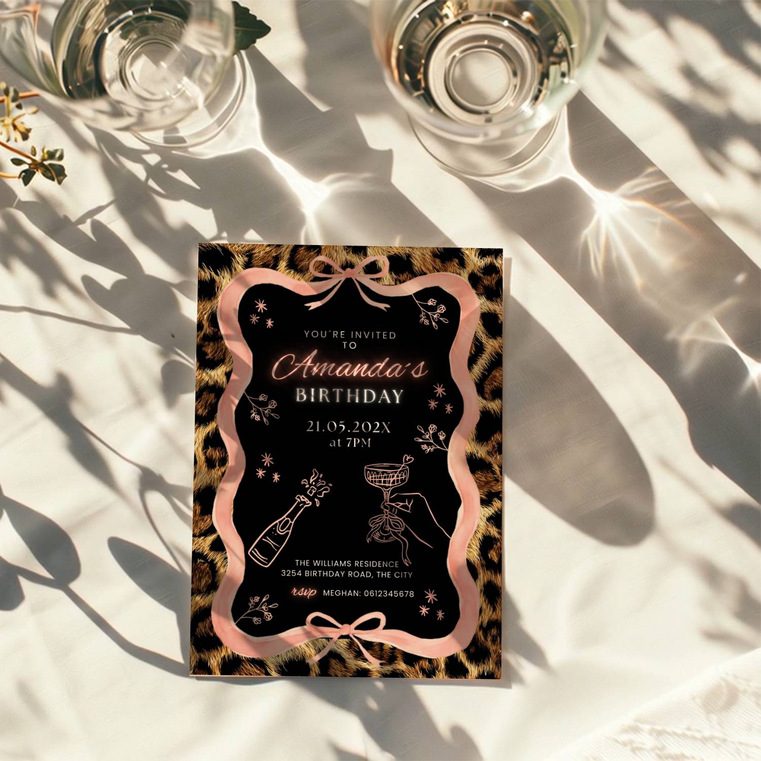 cheetah print birthday invitation with pink ribbon border and black center design