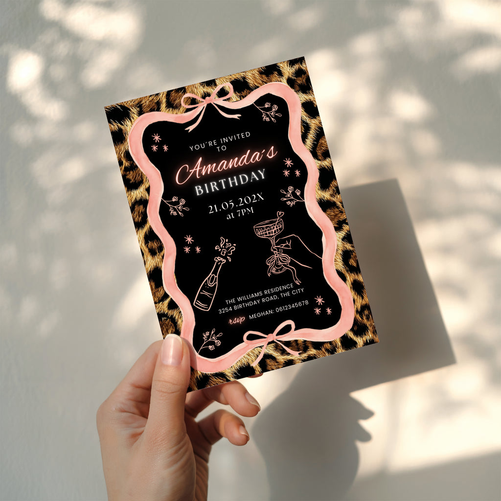 cheetah print birthday invitation with pink ribbon border and black center design